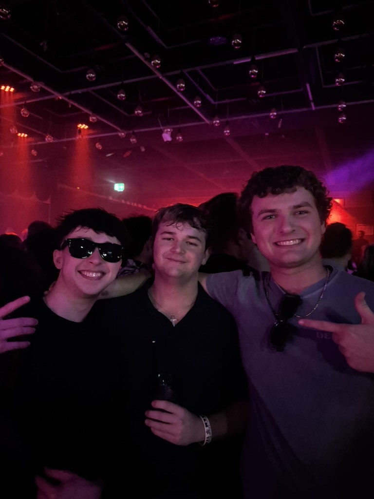 Jake at a club in Europe with vibrant atmosphere.